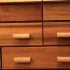 Commode galbée en iroko et kossipo